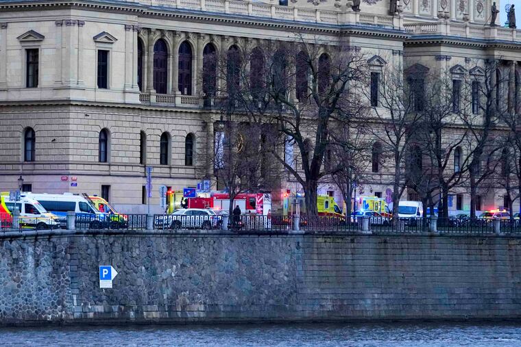 Police officers secure an area after a shooting in downtown Prague, Czech Republic, on Thursday.
