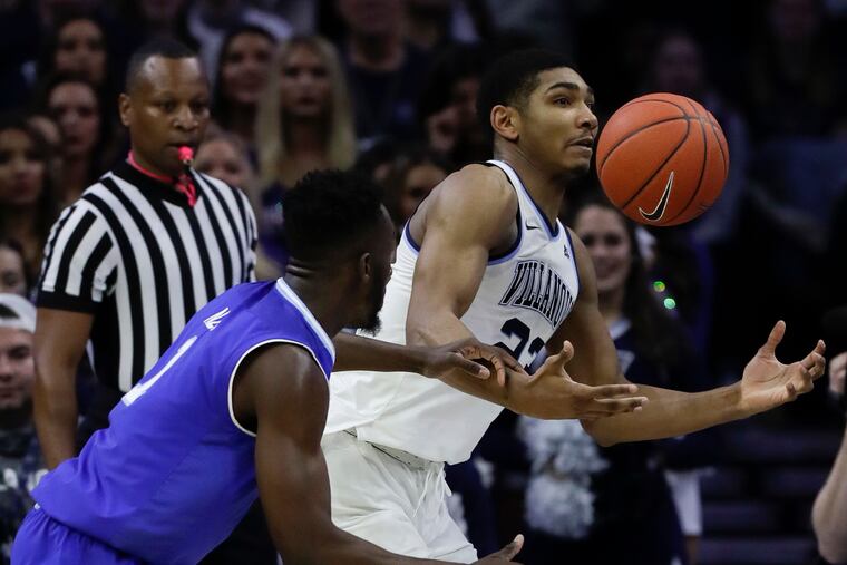 Villanova forward Jermaine Samuels goes after the loose basketball against Seton Hall forward Michael Nzei during the first-half at the Wells Fargo Center on Sunday, January 27, 2019.