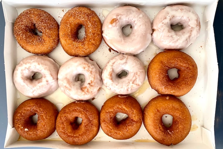 A mixed dozen of hot doughnuts from Brown's Restaurant in Ocean City includes, clockwise from top left, cinnamon sugar, vanilla glazed, and honey-dipped.