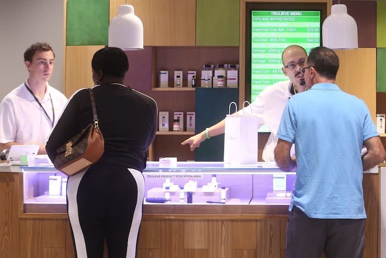 Patient consultants assist patients at Trulieve's medical marijuana dispensary in Orlando on Tuesday, April 24, 2018. Trulieve was awarded one of Florida's first five marijuana licenses, for the northwest region.