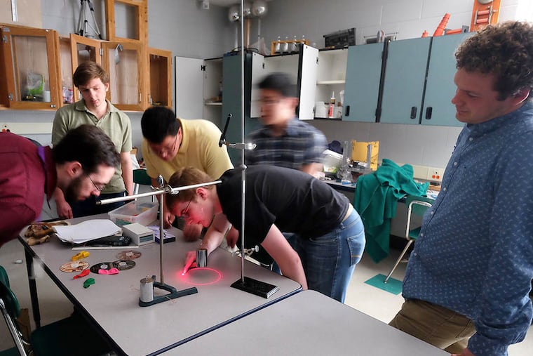 Karl Sewick (center), 17, a senior at Phoenixville Area High School, works with teacher Jay Jennings (left). Karl will compete in Thailand this summer.