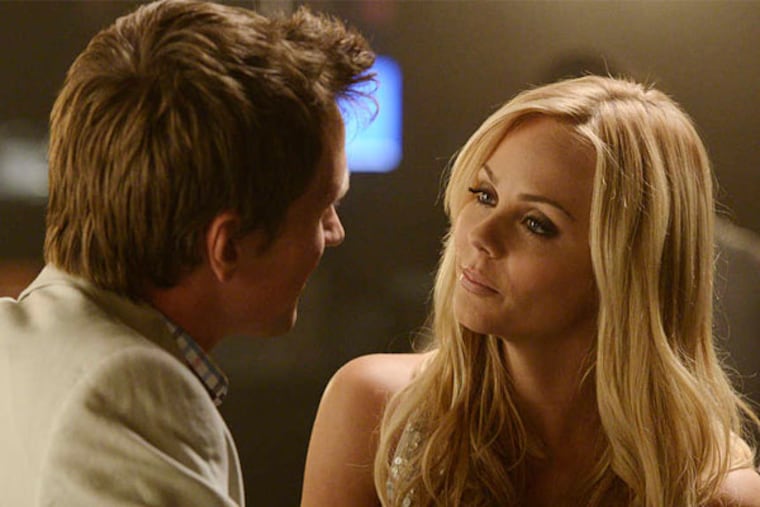 Laura Vandervoort is Elena, torn between the old pack and the sweet life with beau Philip (Paul Greene). (Steve Wilkie/Syfy)