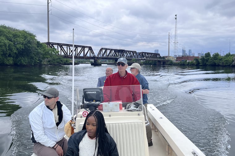 Kianna Bingham (front) of Councimember Jamie Gauthier's office, along with Nathan Boon, of the William Penn Foundation (left); Dave Corddry at the helm; Philadelphia Councilmember Mark Squilla (rear left); and, Nick Pagon of Riverways (rear, right) on a boat tour of the Schuylkill.
