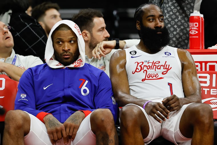 Sixers guard James Harden (right) and forward P.J. Tucker sit on the bench late in the fourth quarter against the Oklahoma City Thunder on Thursday.