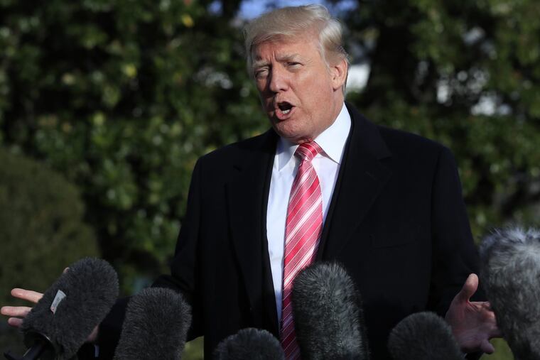 President Trump speaks to reporters before leaving the White House Tuesday, Nov. 21, 2017, in Washington for Thanksgiving trip to his private Mar-a-Lago resort in Florida.