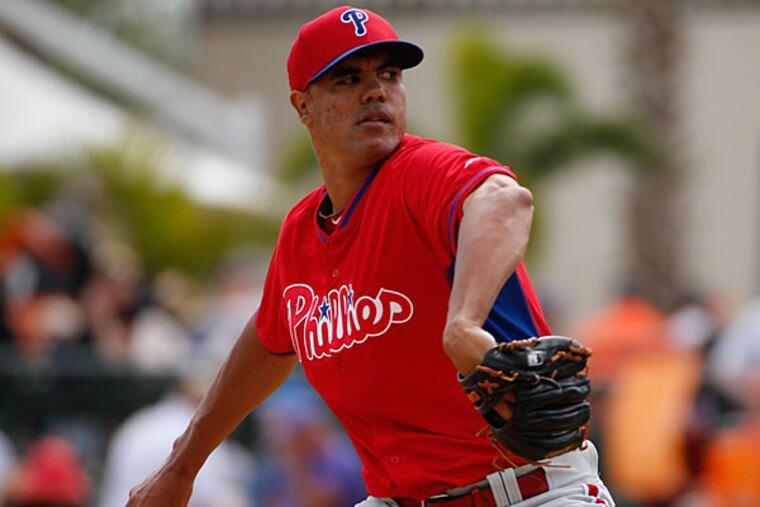 Phillies starting pitcher Miguel Alfredo Gonzalez throws in the fourth inning of an exhibition spring training baseball game against the Baltimore Orioles in Sarasota, Fla., Friday, March 7, 2014. (Gene J. Puskar/AP)