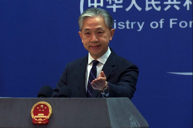 In this image made from video, Chinese Foreign Ministry spokesperson Wang Wenbin gestures as he speaks during a media briefing at the Ministry of Foreign Affairs office in Beijing on Monday.