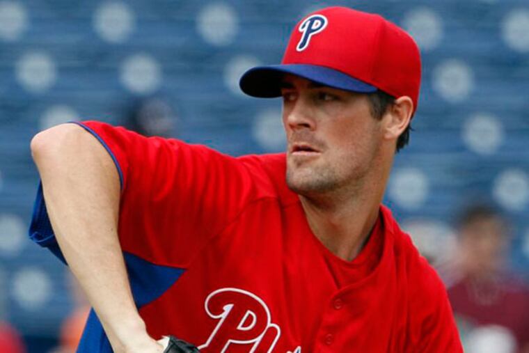 Cole Hamels throws a first-inning pitch during a spring training exhibition game against the Houston Astros. (Yong Kim/Staff Photographer)