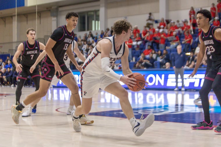 TJ Power looks to make a pass during Penn's 84-78 loss at American on Sunday.