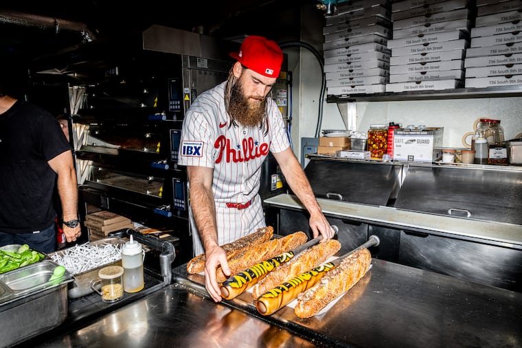 Phillies outfielder and first-time All-Star Brandon Marsh compares Victus' new cheesesteak-themed bat with the real thing while in the kitchen of Angelo's Pizzeria.