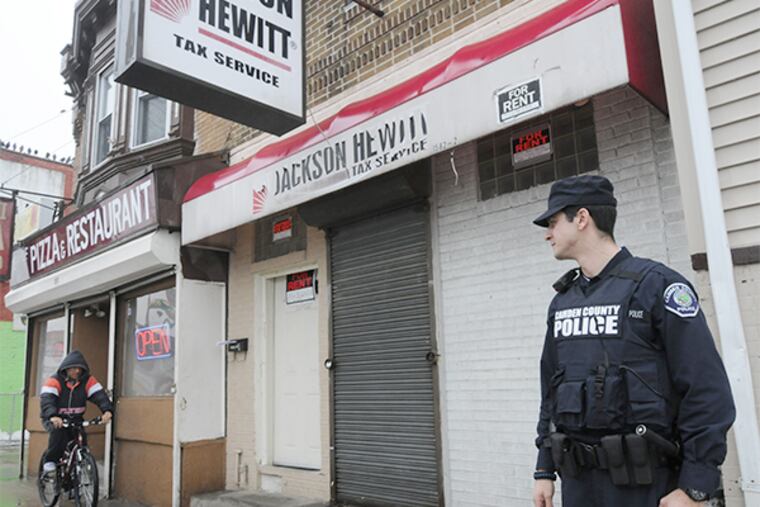 Camden police officer Christian Jeffries in the Whitman Park neighborhood on Feb. 19, 2014. ( APRIL SAUL / Staff )