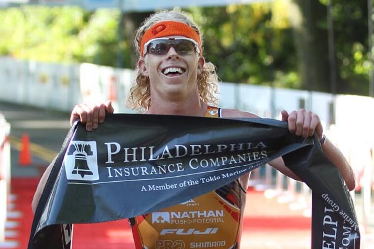 With a time of 1:49:03 Cameron Dye, finished the Philadelphia Triathlon in first place. (Michael Bryant/Staff Photographer)