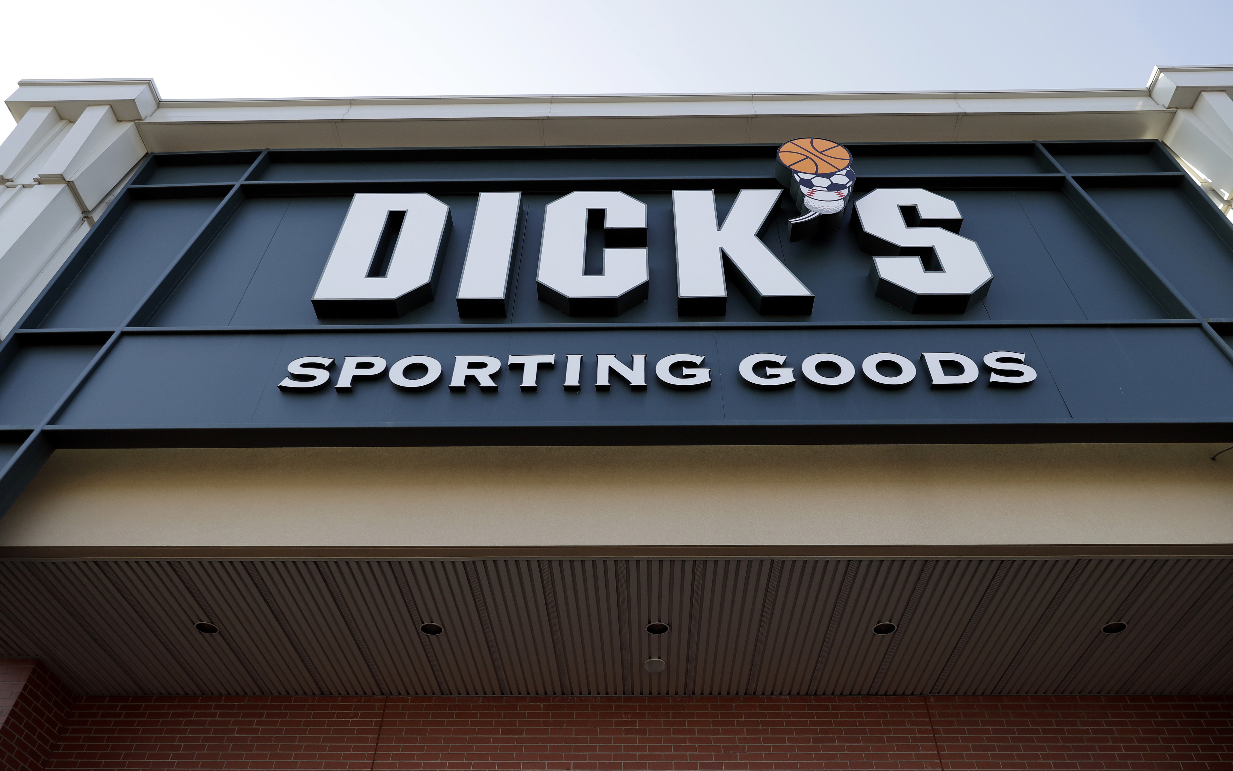 FILE- This Feb. 28, 2018, file photo shows a Dick's Sporting Goods store in Arlington Heights, Ill. Dick's Sporting Goods Inc. announced earlier this year that it will stop selling hunting rifles and ammunition at 125 of its stores, replacing the gear with merchandise it believes will sell better at those locations.