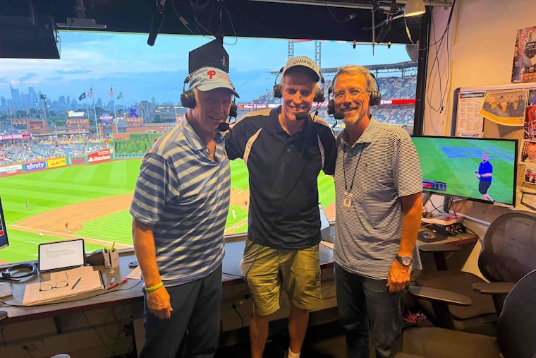 Lewis Kalb (center) poses with Phillies radio broadcasters Larry Andersen (left) and Scott Franzke (right) after joining them on air on Wednesday.