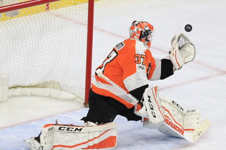 Goalie Brian Elliott of the Flyers stops a shot by the Maple Leafs during their game at the Wells Fargo Center on Dec. 12, 2017. CHARLES FOX / Staff Photographer