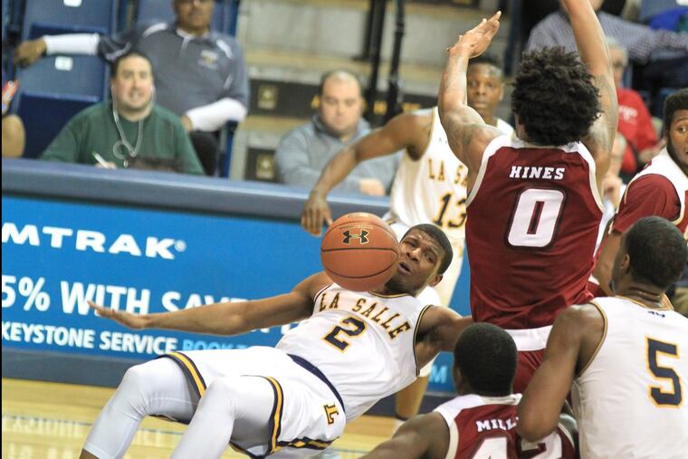 Amar Stukes, left, LaSalle takes a hard fall after being fouled by Malik Hines of Massachusetts on Jan 24, 2018.