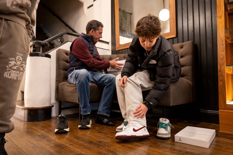 Austin Waldman, 12, is with his dad, David Waldman, who is a Lower Merion Alumni Class of ’92, try out the Nike Dunk Low Protro at Lapstone & Hammer, in Philadelphia, Pa., on Saturday., March. 21, 2026.