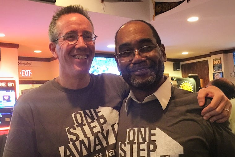 Kevin Roberts (left) during an event to benefit One Step Away, Philadelphia's homeless newspaper.