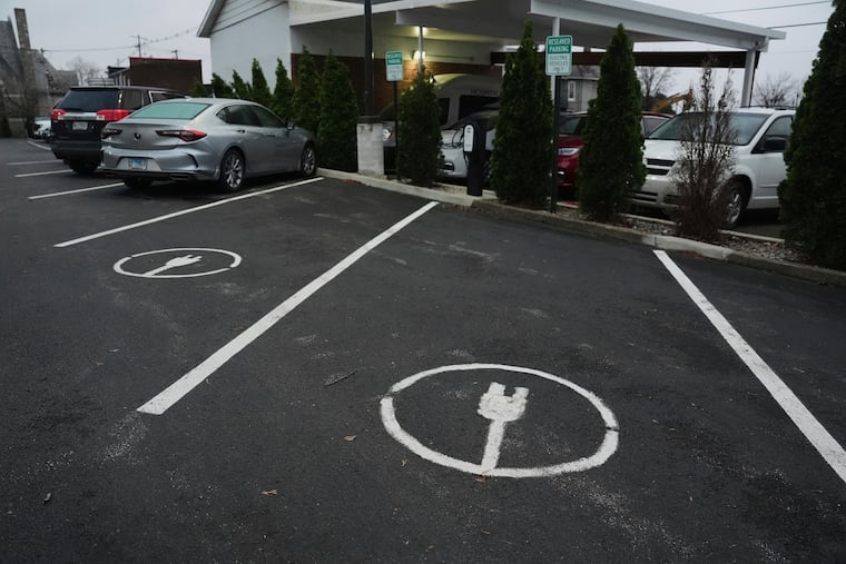 Electric vehicle parking spots sit near charging stations in Evansville, Ind.