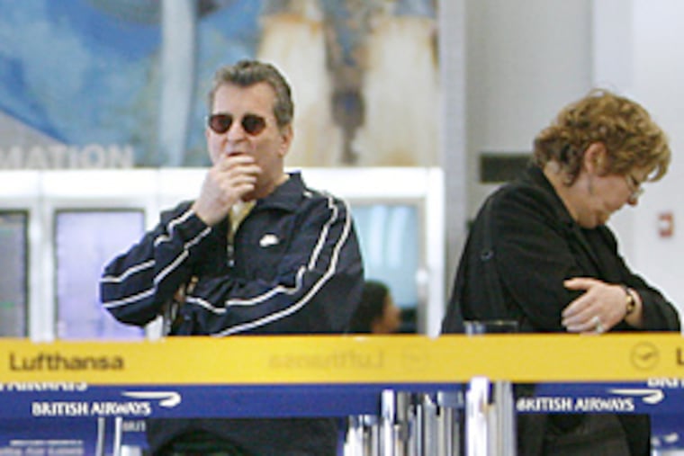 Neal Kushner of Richboro, Pa., (left) is one of many area residents whose travels abroad have been hit hard by the weak dollar. (Elizabeth Robertson/Inquirer)