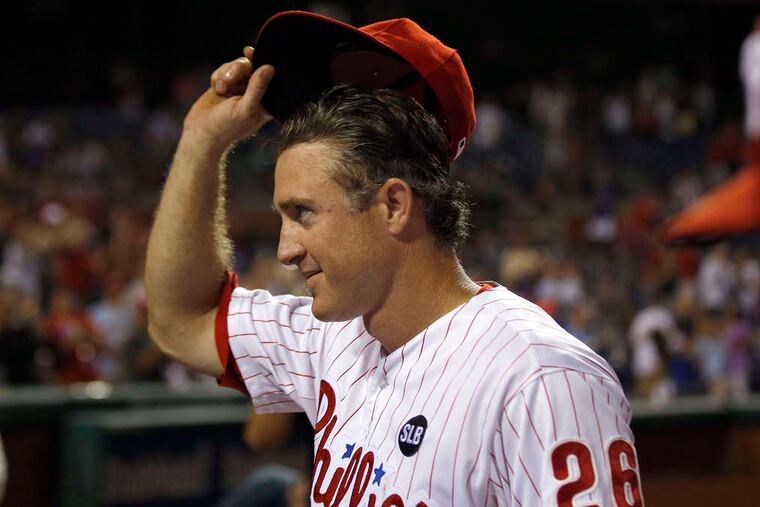 Chase Utley tips his cap as he leaves the field for the last time at Citizens Bank Park. The Southern California native was traded to the Dodgers. YONG KIM / Staff Photographer