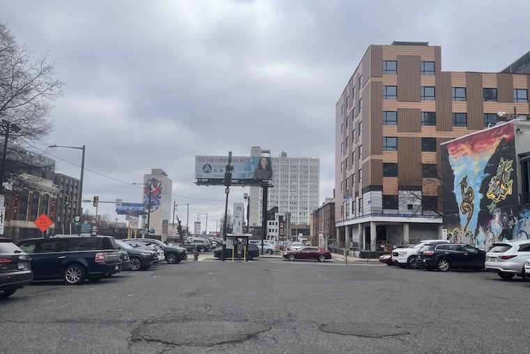 When the Vine Street Expressway was built in the late '80s, several blocks along its southern edge were demolished for parking. Those blocks, which border Chinatown, remain largely empty today. But a new hotel (right) is going up on 13th Street.