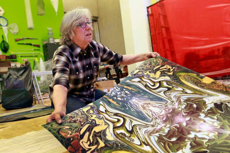 Judy Pfaff, with an exhibit print, said she was responding to what is absent from the gallery's Phila. site - Laura Barnes, who passionately tended the gardens in Merion.