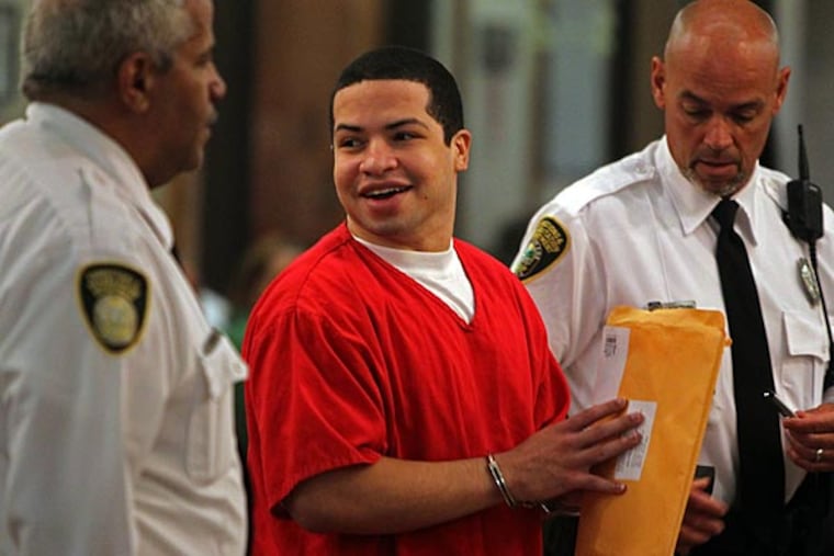 Eric Rivera Jr. is moved to the courtroom holding room for the start of the fourth day of jury deliberation, Monday, Nov. 4, 2013, in the Sean Taylor murder trial, in Miami. Rivera was found guilty of second degree murder Monday in the 2007 killing of Washington Redskins star Sean Taylor. The jury reached its verdict after deliberating about 16 hours over several days in the case. Rivera was also convicted of armed burglary. (AP Photo/The Miami Herald, Walter Michot, Pool)