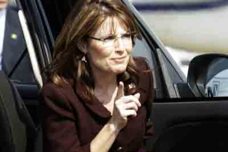 Sarah Palin gets out of a SUV to board her campaign plane to leave Dallas