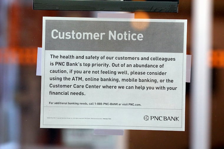 Customer Notice sign on the door of a PNC Bank branch in Voorhees on March 15, 2020. The coronavirus has been spreading across the globe since January, and now has been identified in the Philadelphia region.