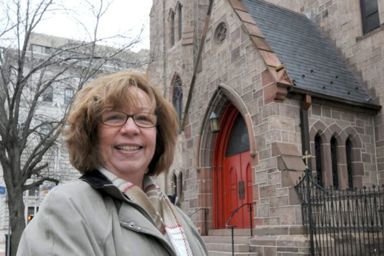 Edna Paris, choir director of La Tuna de la Alegria, outside the Cathedral of the Immaculate Conception in Camden. (April Saul / Staff Photographer)