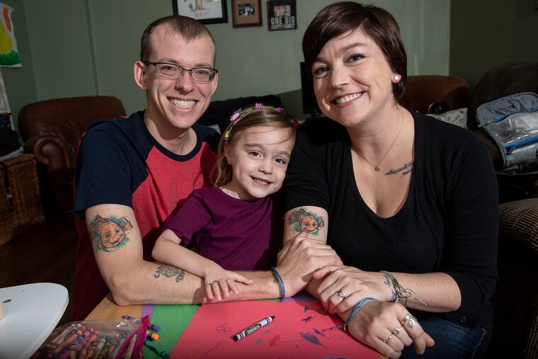 Havertown 4-year-old Scarlett Camburn had surgery to correct paralysis in her right arm. Her parents, Andrea and Chris, got matching Nemo tattoos because the Disney character's lucky right fin is small and weak.
