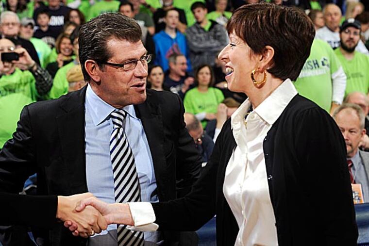 Connecticut head coach Geno Auriemma shakes hands with Notre Dame head coach Muffet McGraw.