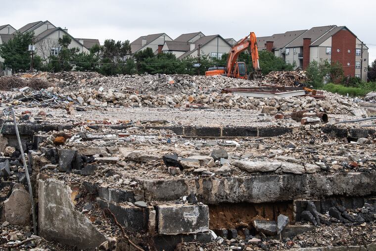 Demolition work continues at a former motel site on North Park Drive overlooking Cooper River Park in Cherry Hill. A 192-unit complex of apartments and townhouses will be built on the site, one of a number of west side locations where recent demolitions are changing the township's longtime look.
