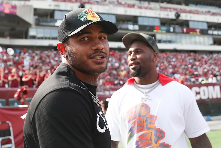 Current Philadelphia Eagles players and Temple alum, Shaun Bradley, left, and Haason Reddick, attend a game against Rutgers at Lincoln Financial Field in South Philadelphia on Saturday, Sept. 17, 2022.