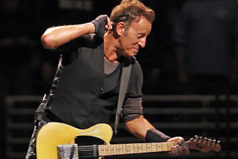 Bruce Springsteen performs during the first of four final concerts at the
Wachovia Spectrum. ( Steven M. Falk / Staff Photographer )