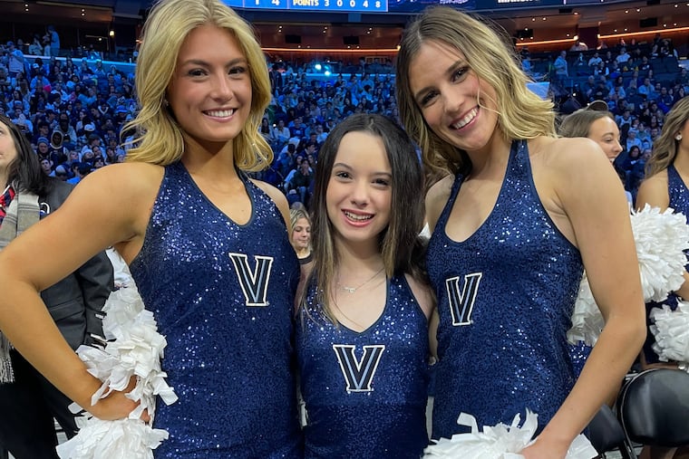 Sarah Pliner (center), a brain tumor survivor, is an honorary member of the Villanova dance team through Team IMPACT, a nonprofit that connects children facing serious and chronic illnesses with college athletic teams.