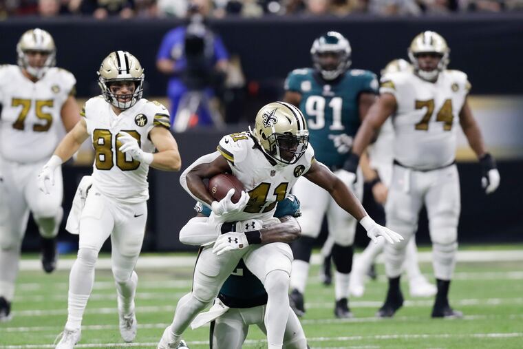 New Orleans Saints running back Alvin Kamara runs with the football against Eagles strong safety Malcolm Jenkins on Sunday, November 18, 2018 in New Orleans.