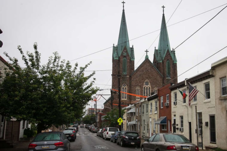 The St. Laurentius Church in Fishtown is known for its soaring copper spires. Its facade has begun to deteriorate in recent years.