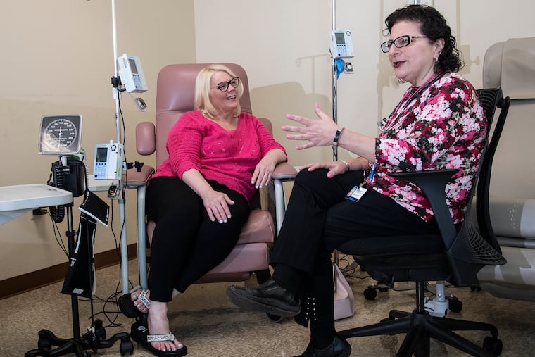 Patient, Lori Inselman, left, interacts with Janine Kyrillos, director of JeffersonÕs Comprehensive Weight Management Program during a consultation in Bala Cynwyd. Kyrillos has admitted Inselman to a closed Facebook Group of other people who were also struggling with weight issues.