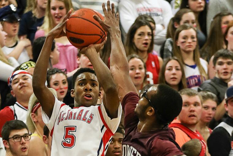 Plymouth Whitemarsh's Xzavier Malone shoots over Lower Merion's Jule Brown.