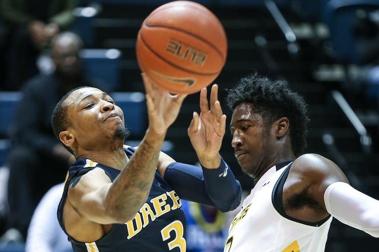 Drexel's Troy Harper throwing a pass over Towson's Allen Betrand during the teams' matchup last week.