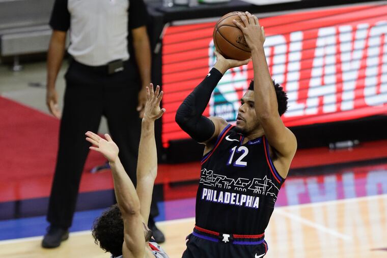 Sixers forward Tobias Harris shoots over Washington guard Raul Neto on Sunday.