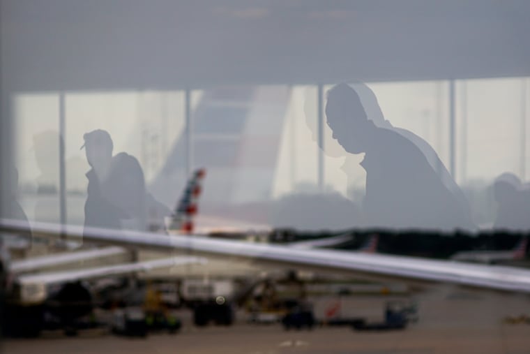 Travelers navigate a terminal at Philadelphia International Airport in September. A measles case was recently reported in a person who traveled through Terminals A and B at the airport.