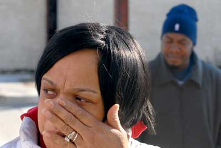 Brushing aside a tear, Diana Seidle mourned two friends inexplicably shot to death Saturday in Grays Ferry. (Tom Gralish / Staff Photographer)