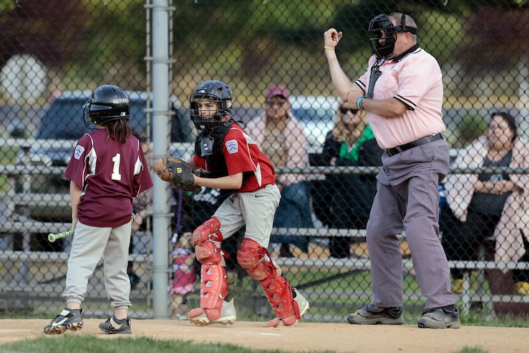 Umpire Brian Kennedy makes the call while officiating a game at the Deptford Little League Complex in Deptfotd, N.J. on May 10, 2023.