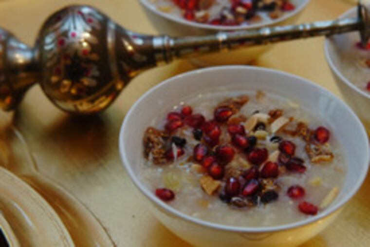 Ashure, with a flask of rosewater. After the Ark landed, legend says, Noah and his crew made it of grains, fruits and nuts.