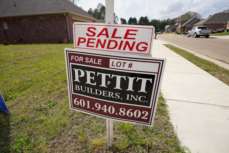 A "sale pending" sign stands along side a housing lot in Madison County, Miss. U.S. long-term mortgage rates continued to edge higher this week as the benchmark 30-year loan stayed above the 3% mark. Rates remain near historic lows, however.