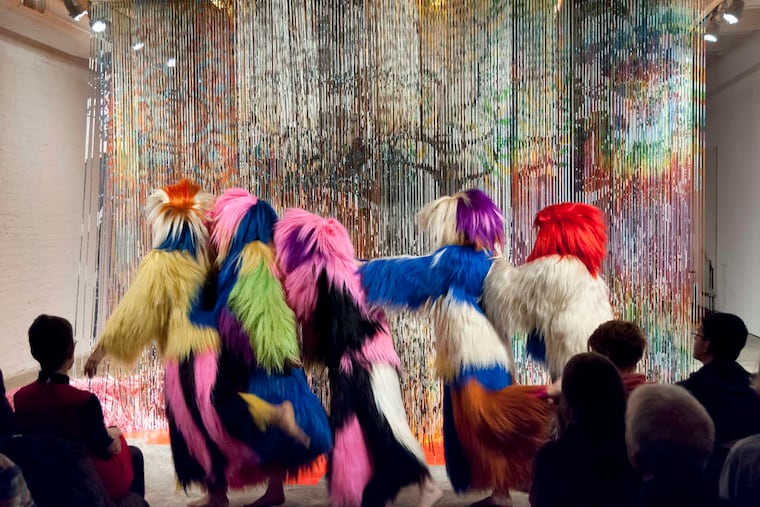 "Architectural Forest" opened Nick Cave's exhibition at Fabric Workshop and Museum with dancers and musicians in an environment of shimmering bands of painted bamboo.