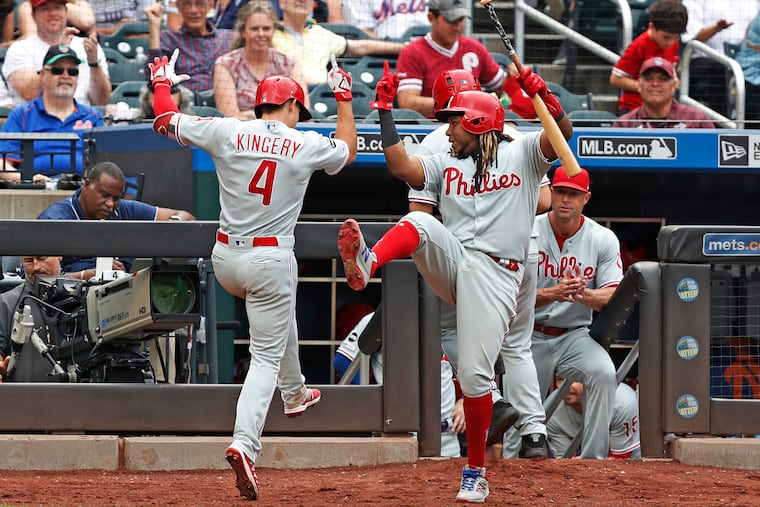 Philadelphia Phillies' Maikel Franco (7) celebrates with Phillies' Scott Kingery (4) after Kingery hit a two-run home run during the seventh inning of a baseball game against the New York Mets, Sunday, Sept. 8, 2019, in New York. Franco hit a two-run, home run earlier in the game. (AP Photo/Kathy Willens)